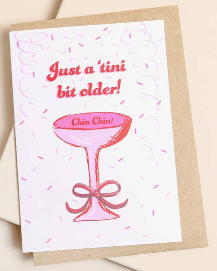 Greeting card with a pink cocktail glass and text on a beige background