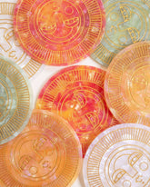 Set of round handmade coasters in various colours acetate with engraved, gold-filled Sol face detail. Suitable for indoor or outdoor use. Perfect for home décor or barware.