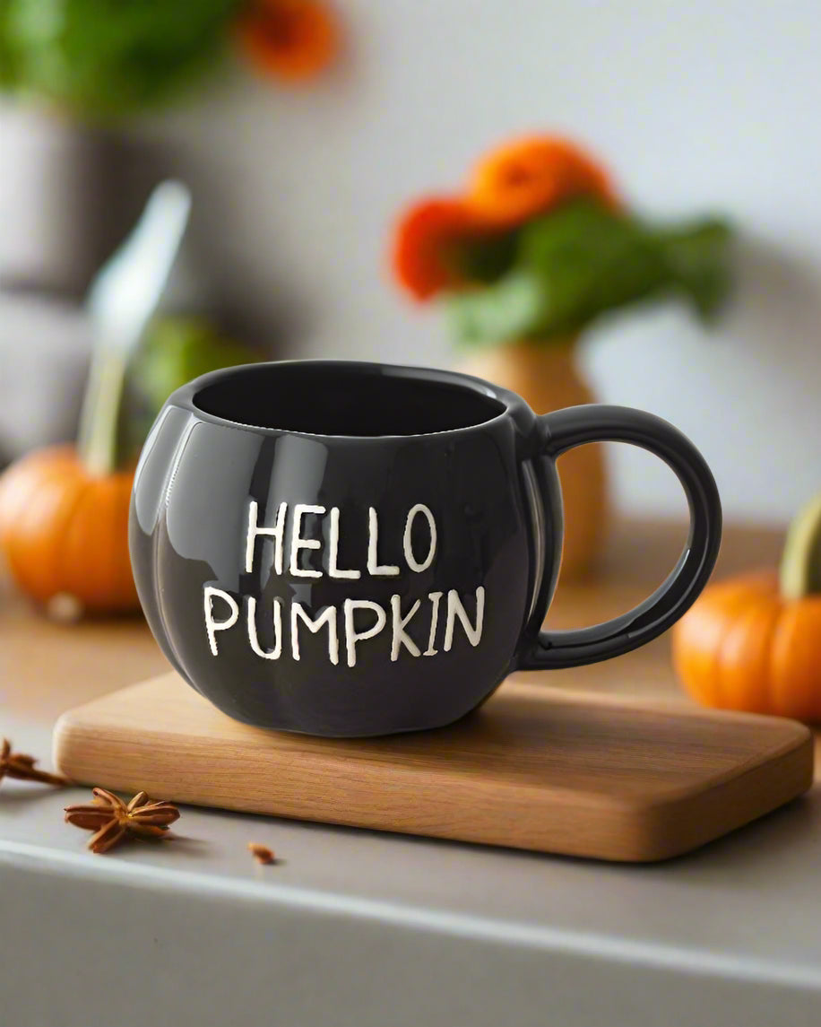Durable black ceramic mug with a glossy glaze and embossed “Hello Pumpkin” slogan. Perfect for autumn vibes.