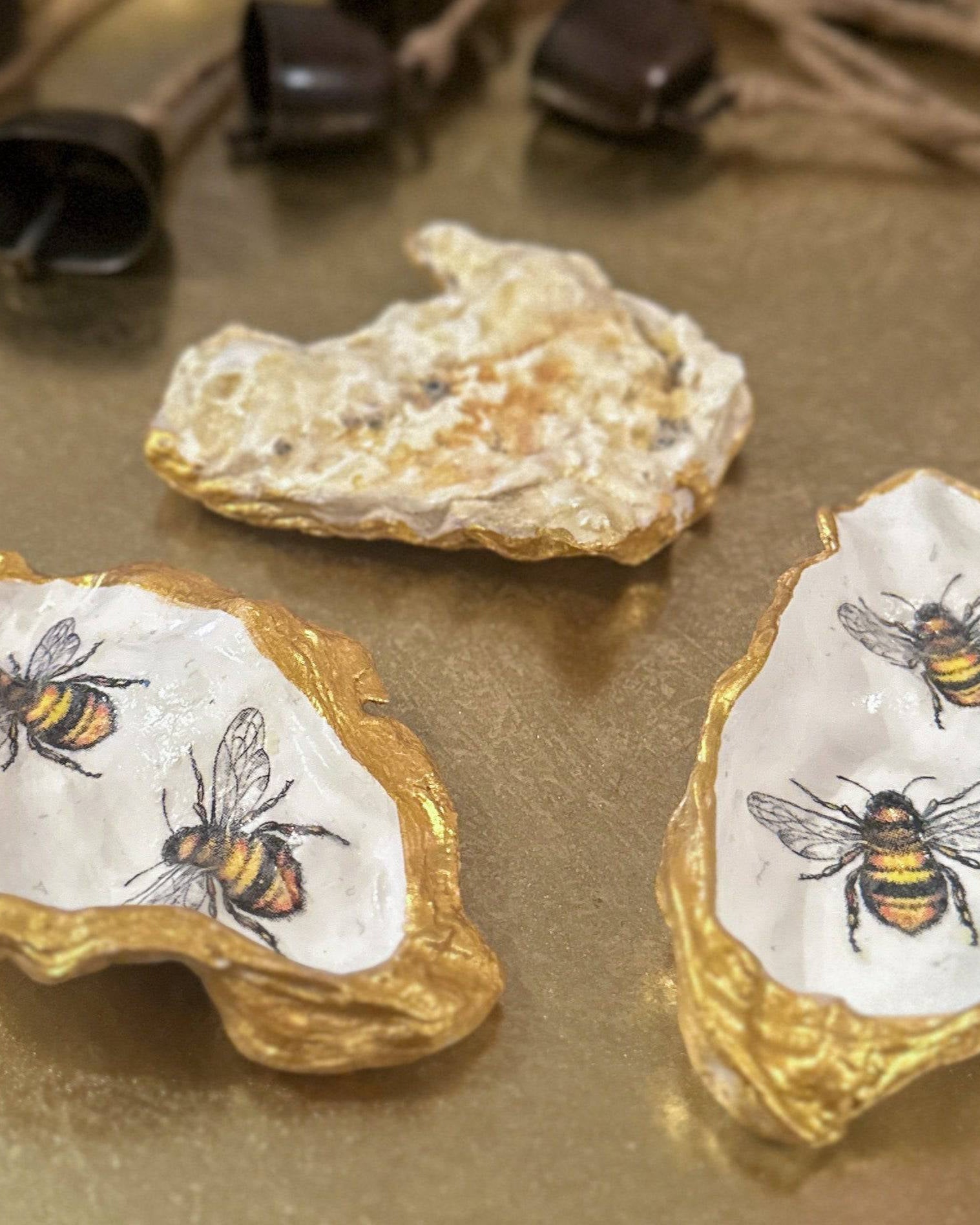natural back, oyster shell trinket dish featuring two bumble bees, crafted using a meticulous decoupage technique with hand-painted gold edges, perfect for spring jewellery storage or home decor.