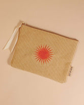 Pale ochre corduroy pouch with a zip closure, fully lined, and an orange sun design. Perfect for storing makeup, toiletries, or travel essentials.