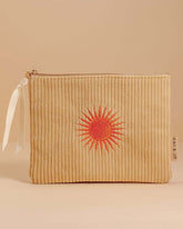 Pale ochre corduroy pouch with a zip closure, fully lined, and an orange sun design. Perfect for storing makeup, toiletries, or travel essentials.