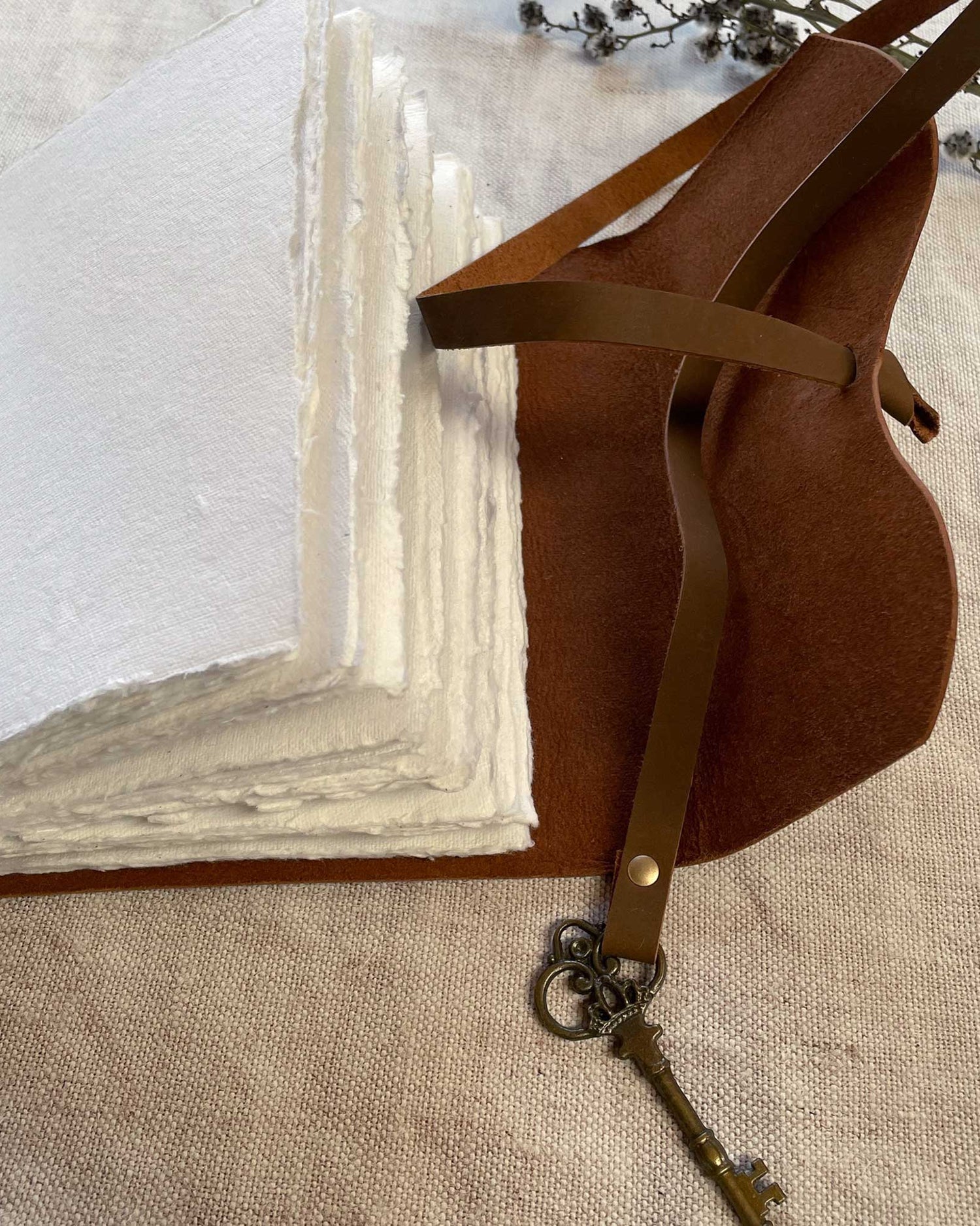 Close-up A5 Leather Bound Journal with Handmade Paper and Key Closure
