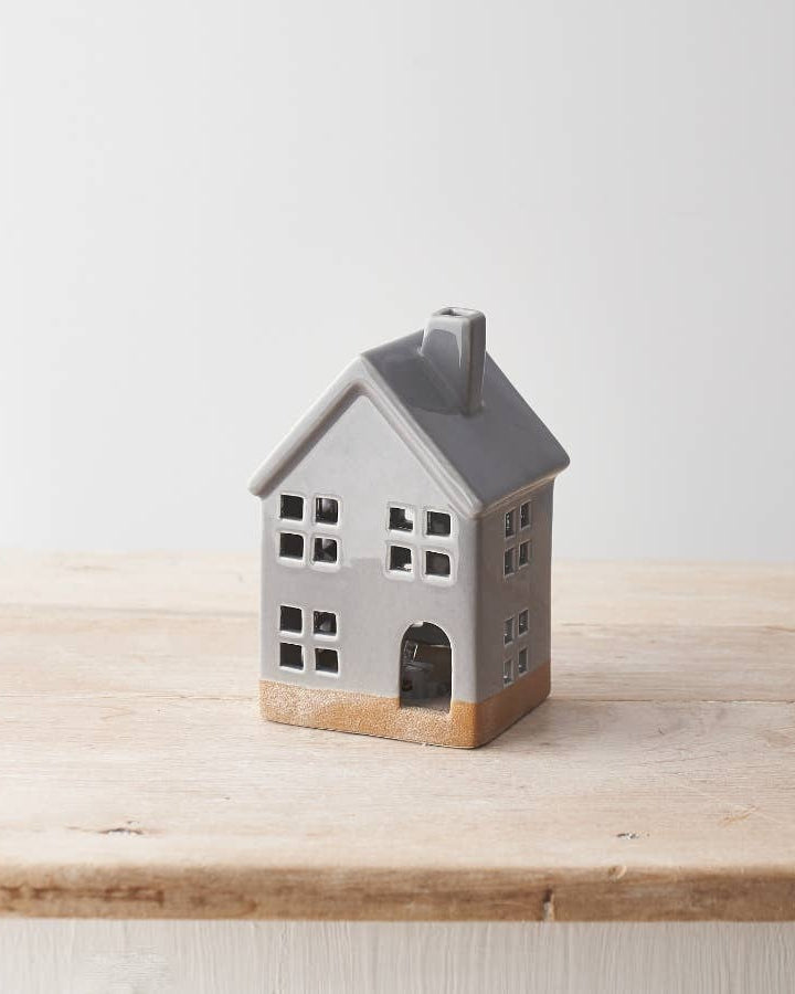 Hand-finished ceramic LED house with a glossy grey glaze. A cosy autumn decoration.
