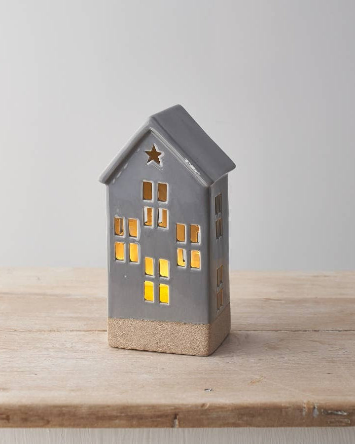 Tall ceramic LED house with a hand-finished design and grey glaze. Perfect for autumn evenings.