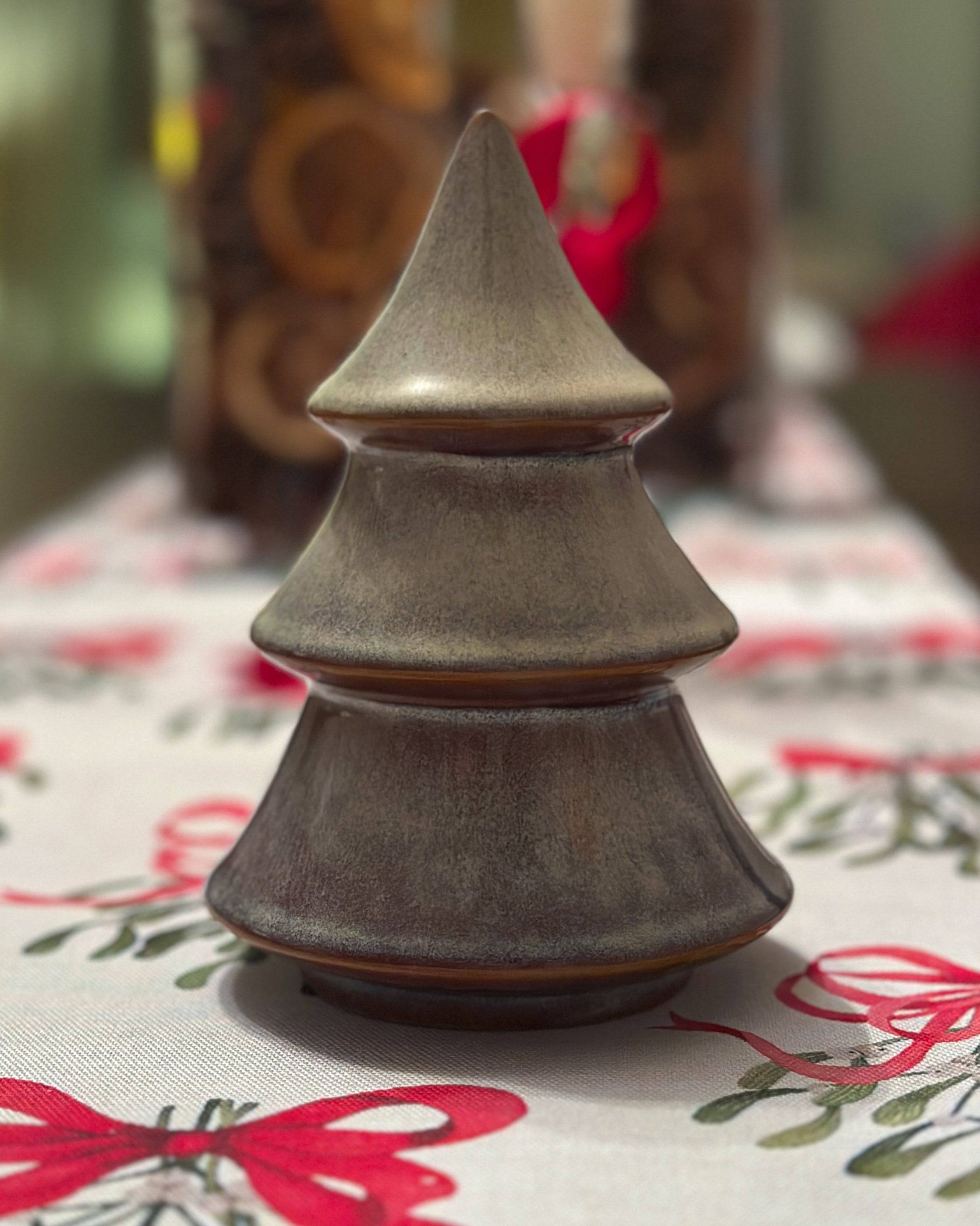 Porcelain Christmas tree ornament with a layered design and reactive glaze. Hand-finished and festive.