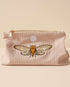 Medium pale pink corduroy pouch with a zip closure and embroidered designs of butterflies and flying insects. Fully lined for storing makeup, toiletries, or travel essentials.