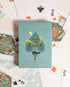 Premium-grade playing cards in sage green with a gold-foiled tuck box featuring an ace of spades design with a snake wrapped around it. Ideal for games and gifting.