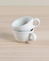 Set of two eco-friendly Juco fringe coasters crafted from sustainable materials. Perfect for protecting surfaces with style.