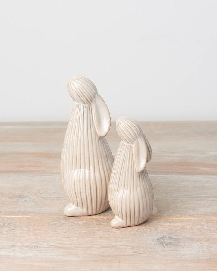 Standing ceramic bunny with a ribbed reactive glaze finish in white/cream. Ideal for Easter or spring décor.