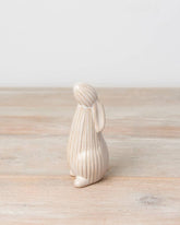Standing ceramic bunny with a ribbed reactive glaze finish in white/cream. Ideal for Easter or spring décor.
