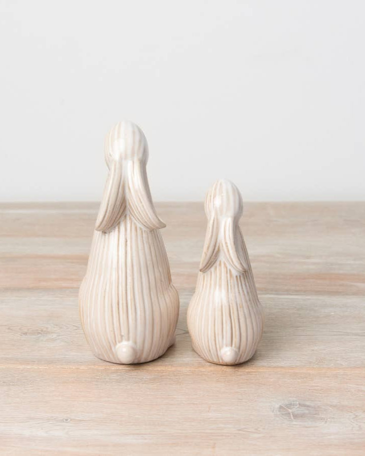 Standing ceramic bunny with a ribbed reactive glaze finish in white/cream. Ideal for Easter or spring décor.