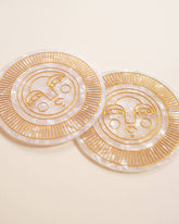 Set of two round pearl acetate coasters with engraved, gold-filled Sol face detail. Handmade for both indoor and outdoor use. Ideal for home décor or barware.