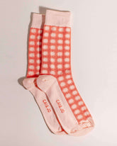 Orange socks featuring an all-over sunshine design. Made from 75% cotton for comfort, one size fits most.