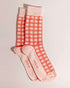 Orange socks featuring an all-over sunshine design. Made from 75% cotton for comfort, one size fits most.