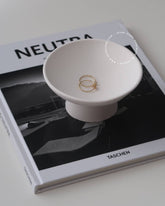 Tasai pedestal bowl, a handcrafted minimalist masterpiece made from eco-friendly resin.