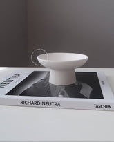 Tasai pedestal bowl, a handcrafted minimalist masterpiece made from eco-friendly resin.