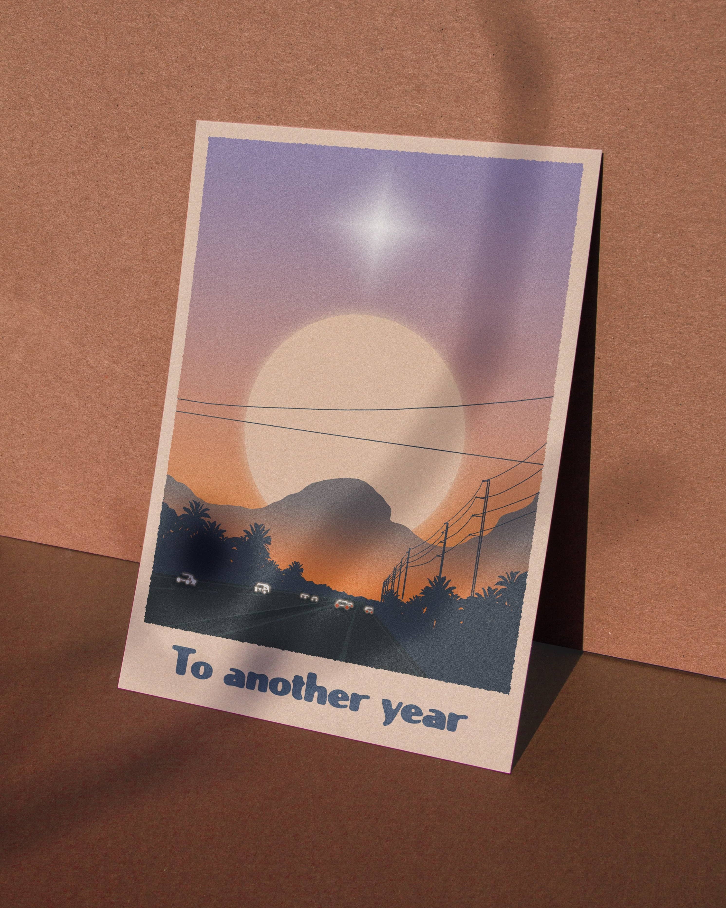 A6 eco-friendly card with "To Another Year" text, depicting a city and mountain scape. Ideal for anniversaries, birthdays, New Year&