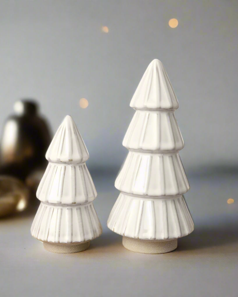 White ceramic tree ornament with a reactive glaze finish. An elegant addition to any minimalist or modern Christmas decor.