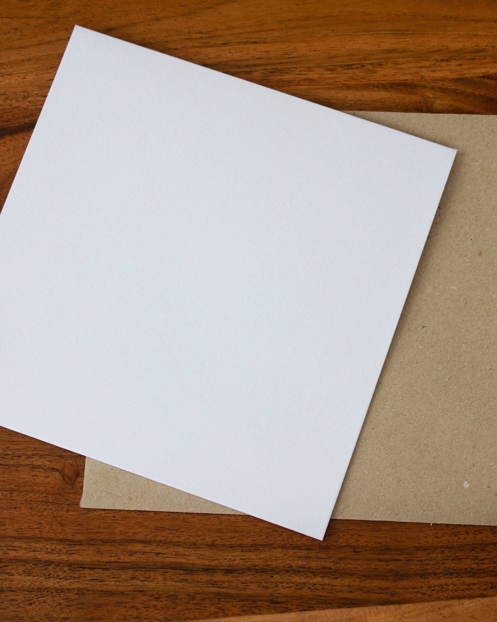 Kraft and white envelopes placed on a table