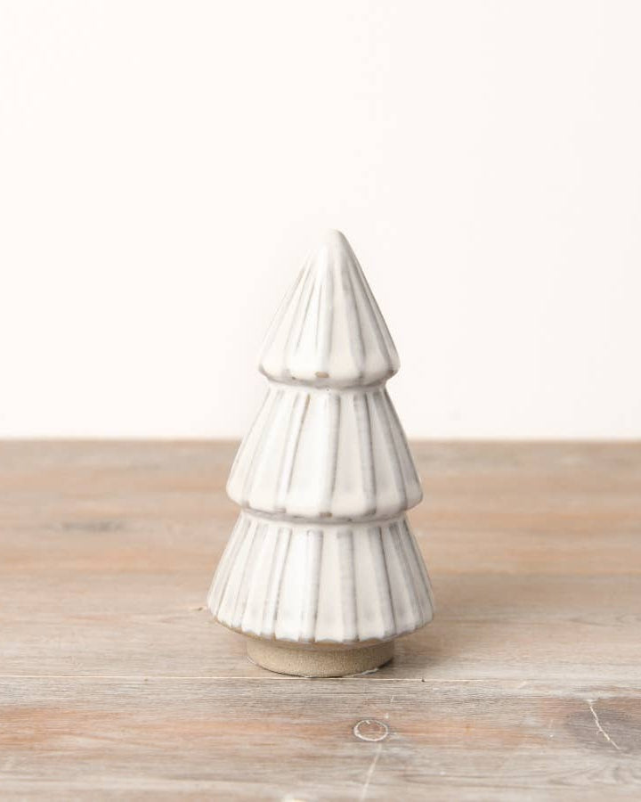 White ceramic tree ornament with a reactive glaze finish. An elegant addition to any minimalist or modern Christmas decor.