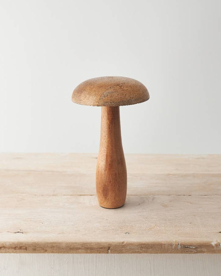 Mango wood mushroom ornament with a smooth, natural finish. A rustic addition to your autumn décor.