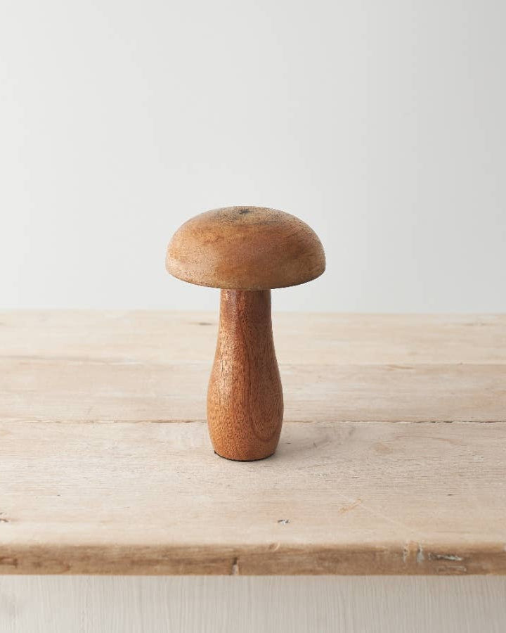 Mango wood mushroom ornament with a smooth, natural finish. A rustic addition to your autumn décor.