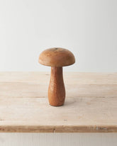 Mango wood mushroom ornament with a smooth, natural finish. A rustic addition to your autumn décor.