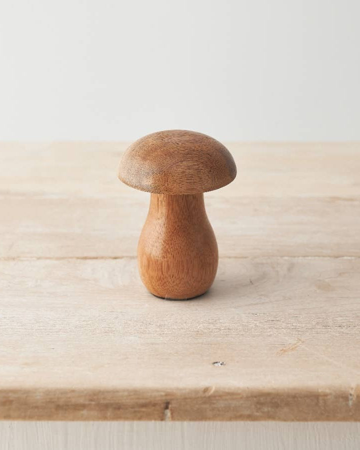 Mango wood mushroom ornament with a smooth, natural finish. A rustic addition to your autumn décor.
