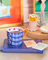 Manifest Manifest Manifest Mug on Table