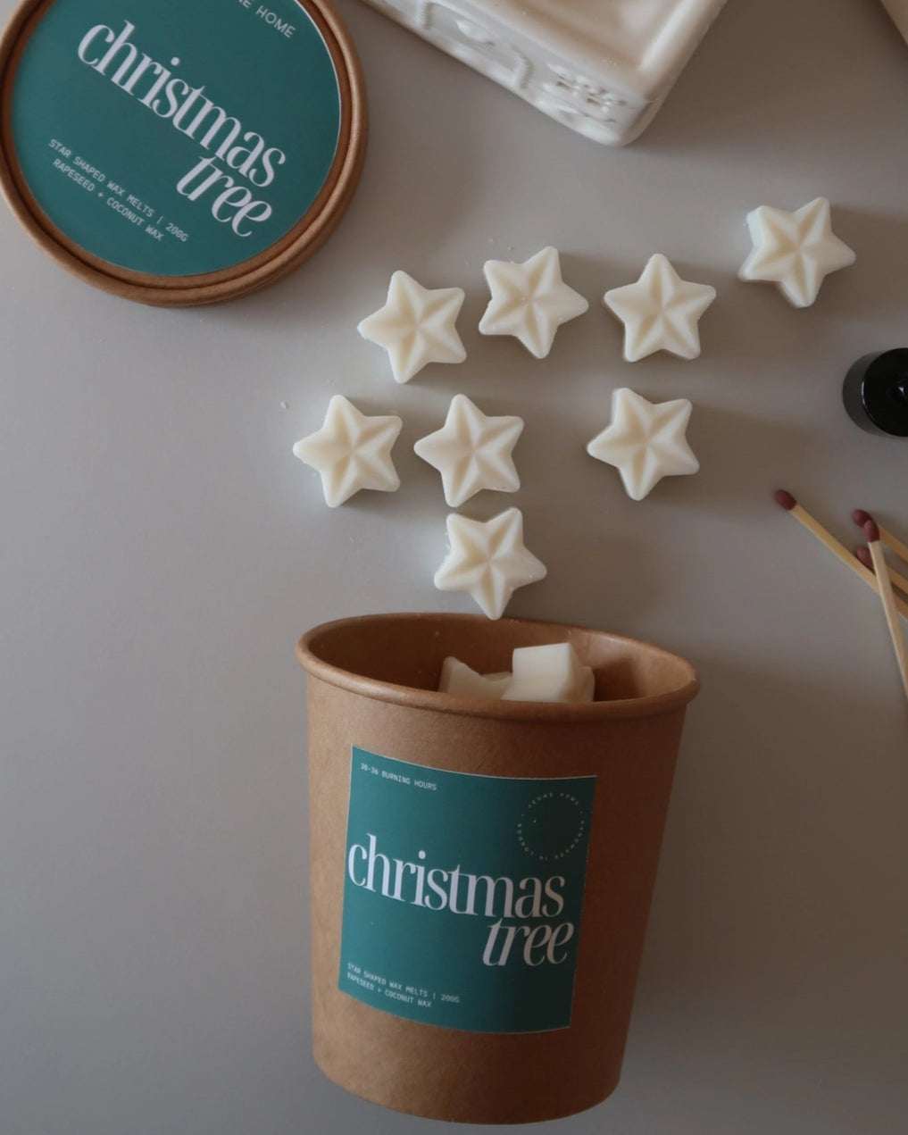 Cup with star-shaped cookies and a container labeled &