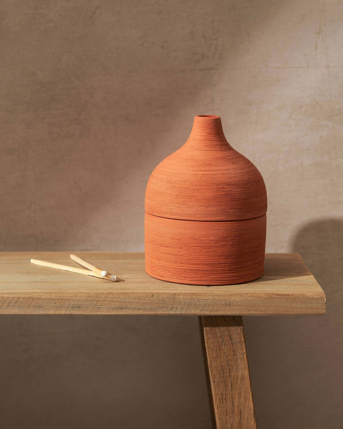 Moroccan Amber & Orris Root Textured Terracotta Candle on Bench