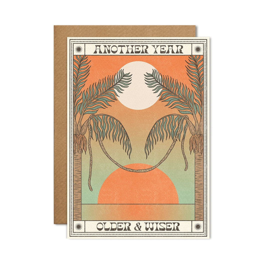 A6 eco-friendly birthday card with &quot;Another Year Older &amp; Wiser,&quot; featuring an orange sun and palm trees reminiscent of a sunset. Includes a Kraft envelope and biodegradable cello wrap.