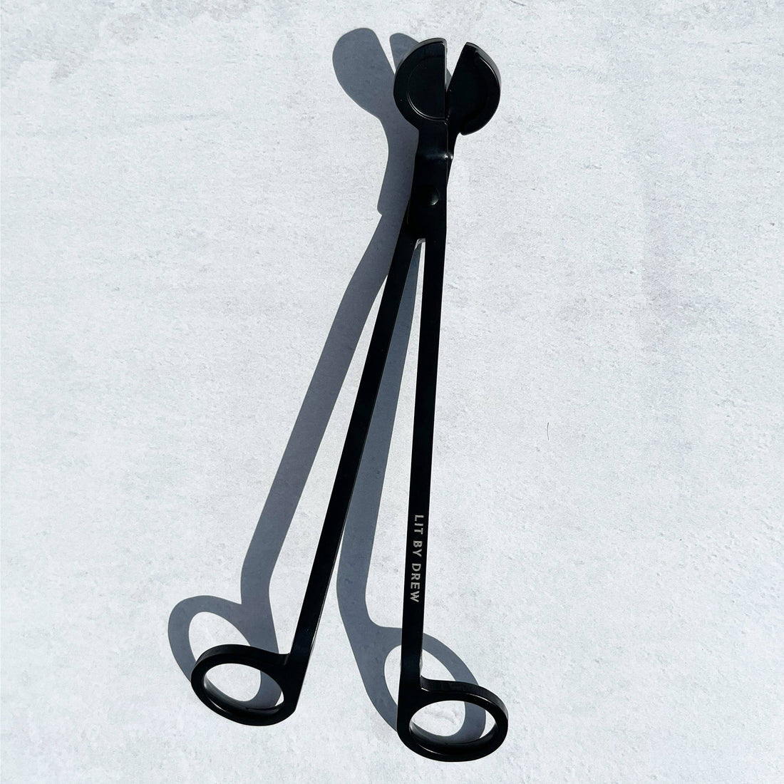 Black Candle Wick Trimmer for maintaining candle cleanliness and safety.