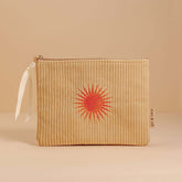 Pale ochre corduroy pouch with a zip closure, fully lined, and an orange sun design. Perfect for storing makeup, toiletries, or travel essentials.