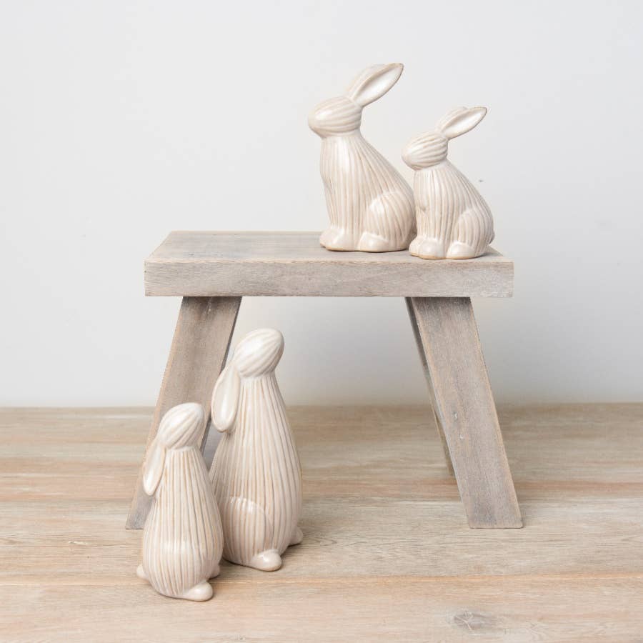 ceramic bunnies with a ribbed reactive glaze finish in white/cream. Ideal for Easter or spring décor.