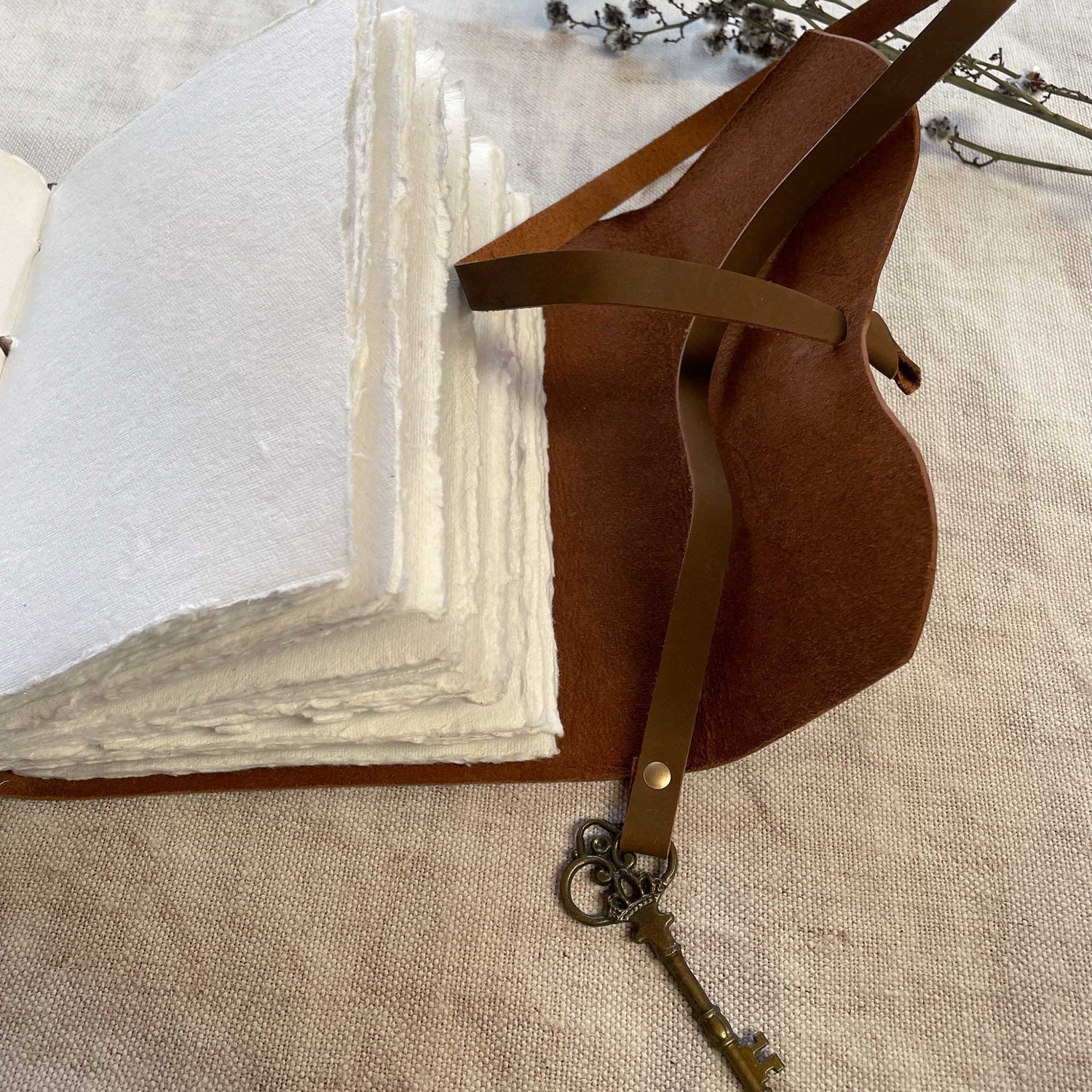 Close-up A5 Leather Bound Journal with Handmade Paper and Key Closure