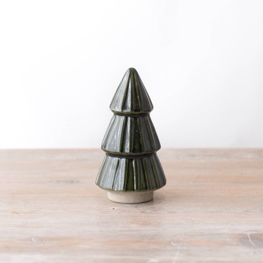 Green ceramic Christmas tree ornament with a reactive glaze finish, adding a festive and sophisticated touch to seasonal decorations.