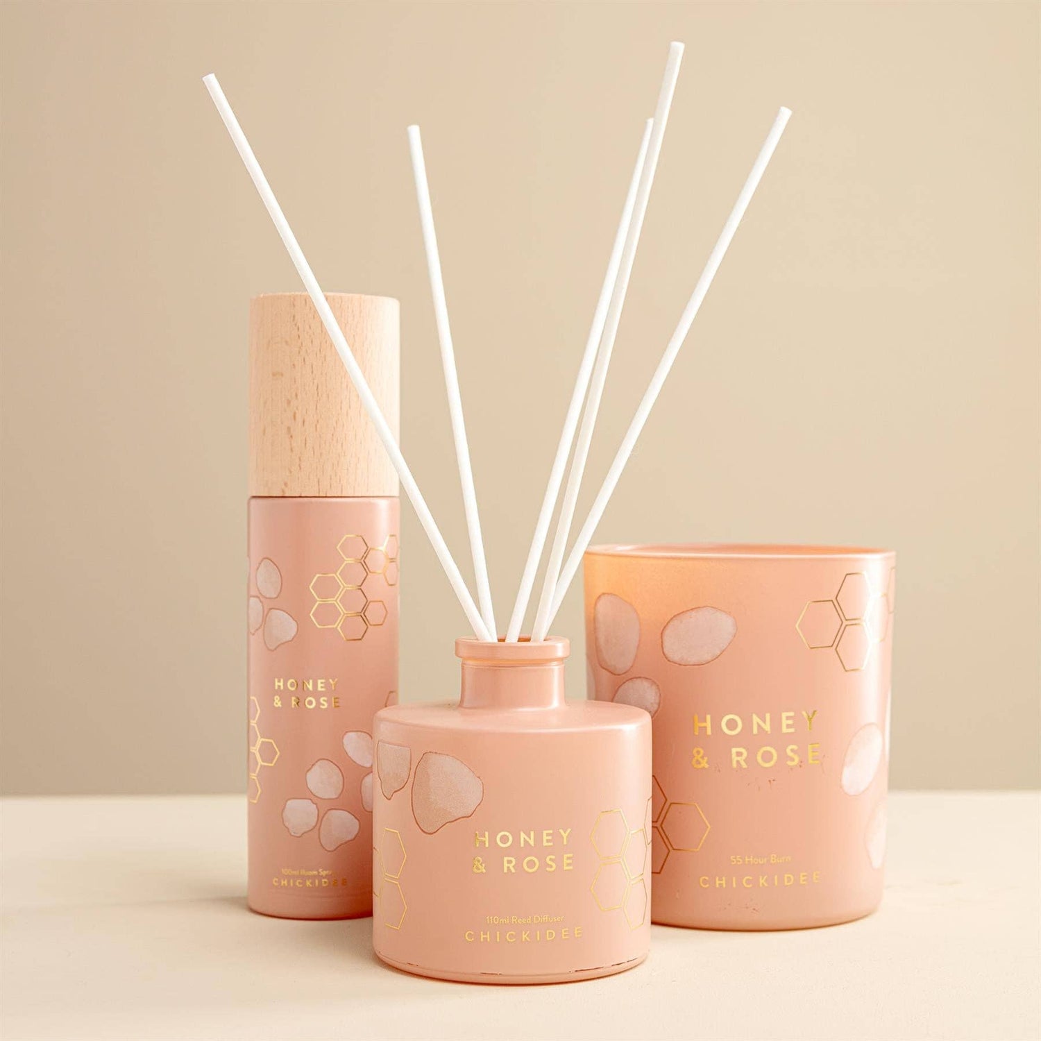 Handcrafted reed diffuser with natural botanicals and premium fragrance oils in a Honey &amp; Rose scent.