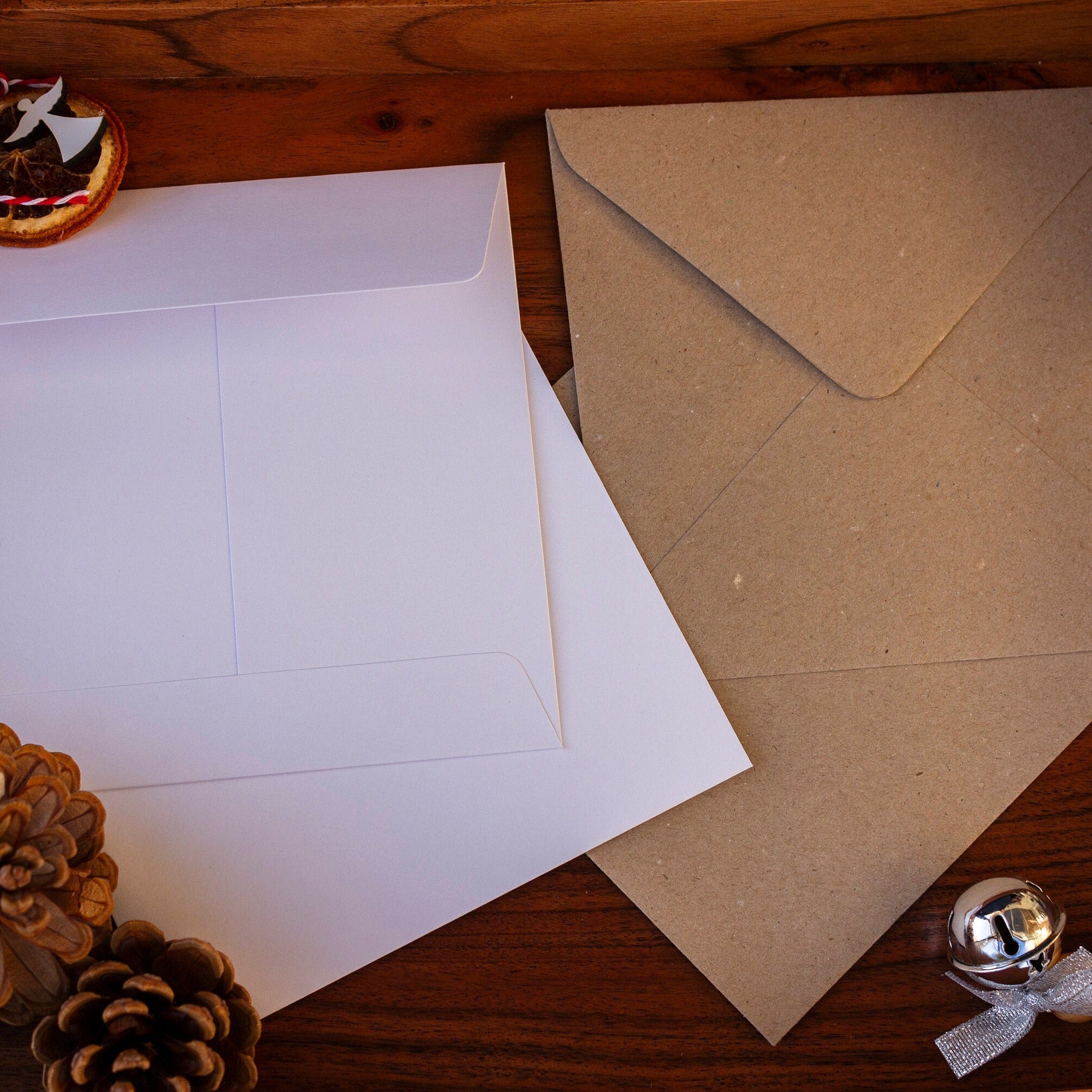 Square kraft and white envelopes, sustainable.