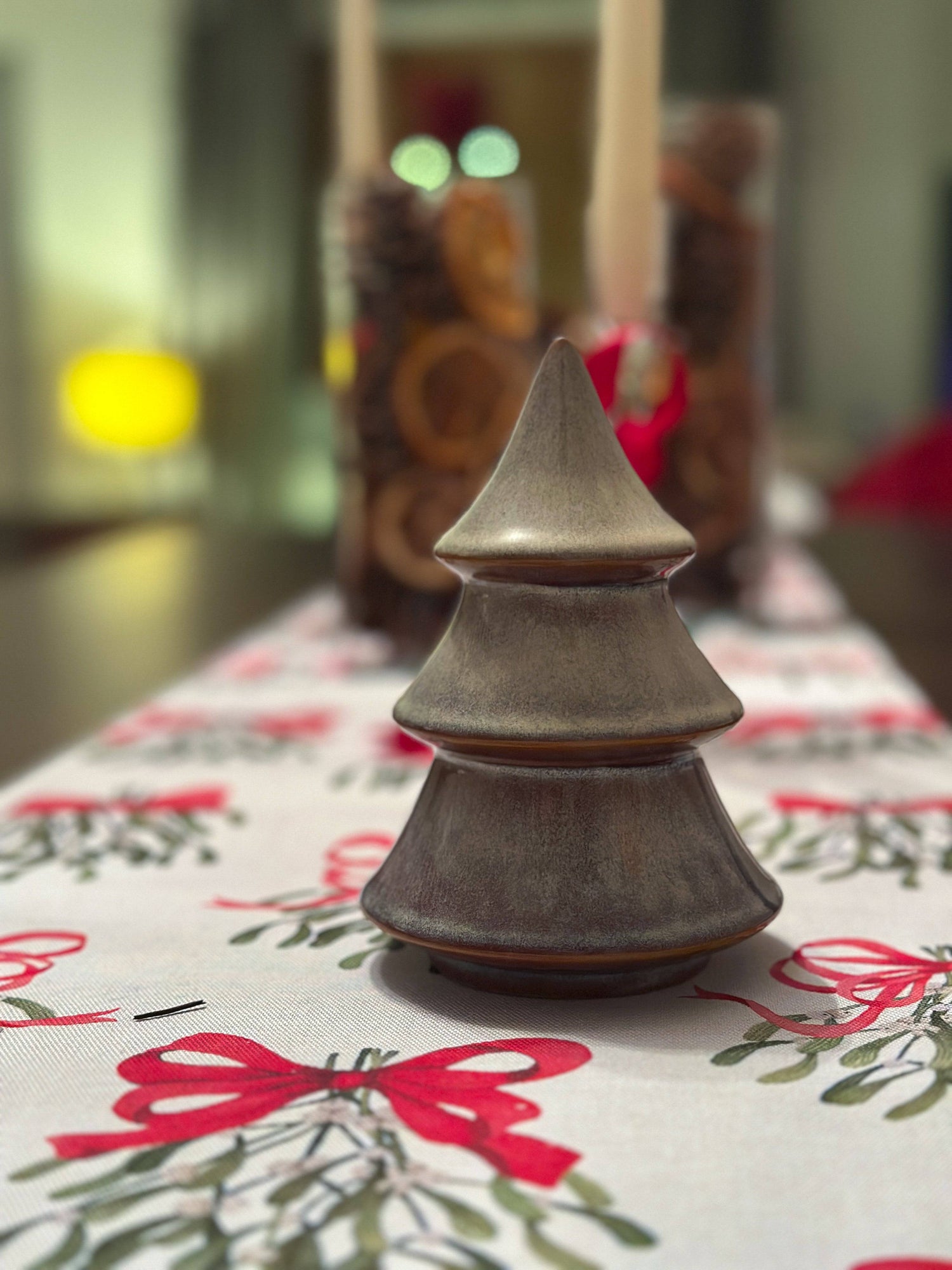 Porcelain Christmas tree ornament with a layered design and reactive glaze. Hand-finished and festive.