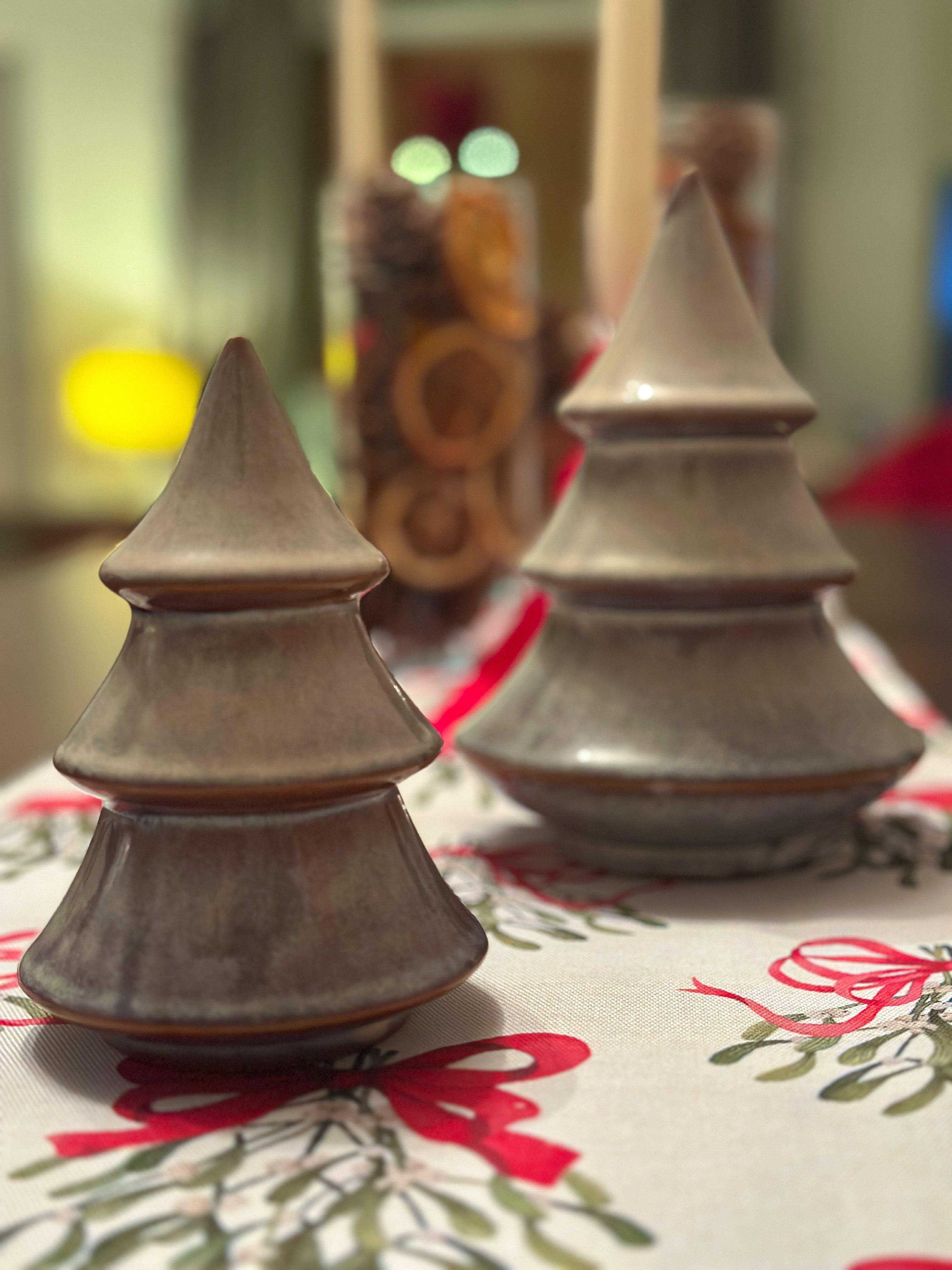 Porcelain Christmas tree ornament with a layered design and reactive glaze. Hand-finished and festive.