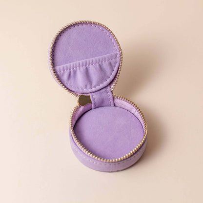 Open lavender velvet polyester mini travel jewellery case with a zip closure and an embroidered sun design. Ideal for travel and jewellery storage.