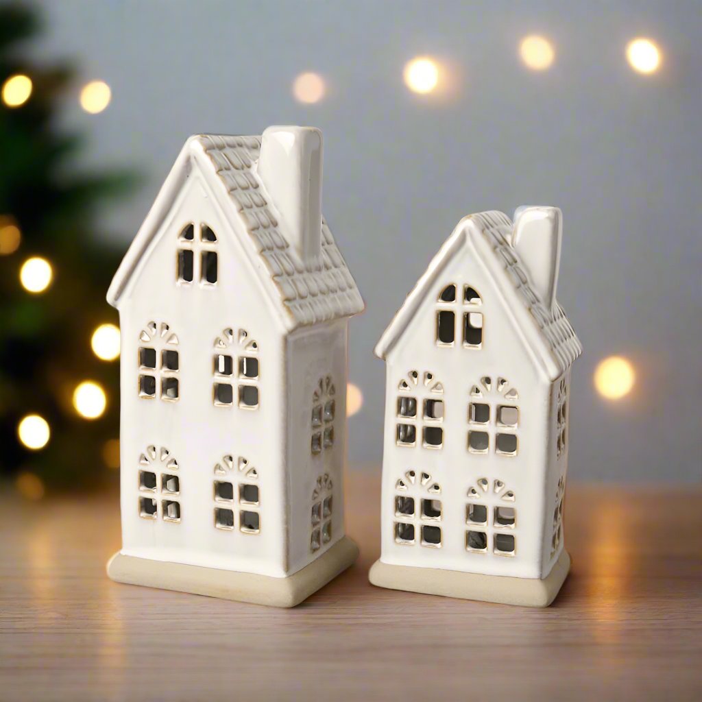 Hand-finished ceramic LED house with a textured roof and natural reactive glaze. Perfect for Christmas décor.