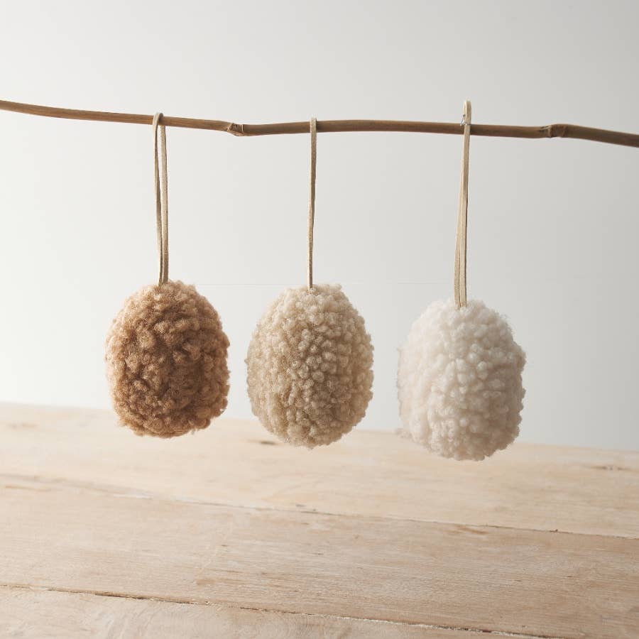 Set of three neutral hanging egg ornaments made from sherpa fabric with jute string. Perfect for Easter decoration.