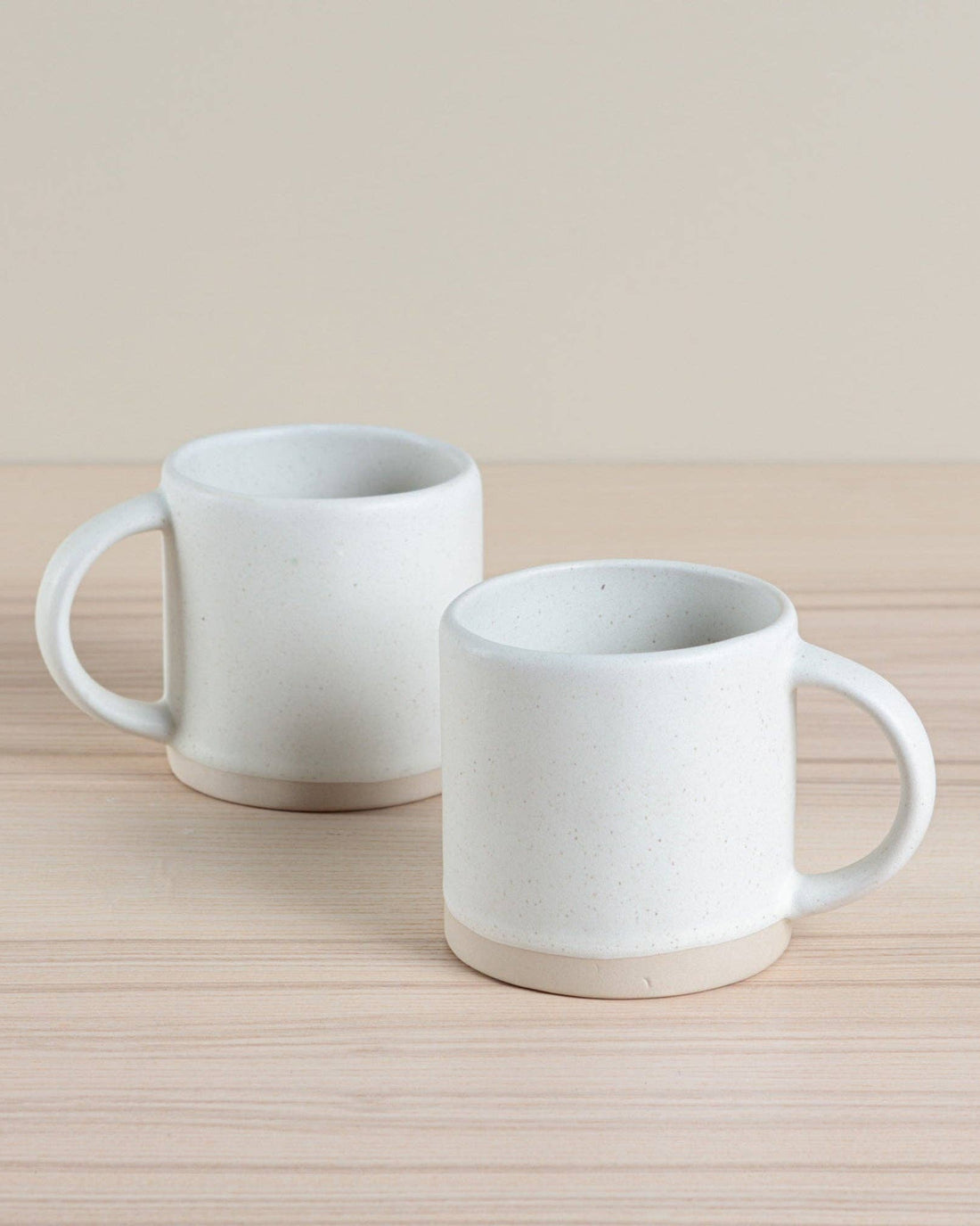 Handmade ceramic Organic Classic Mug in oatmeal, crafted using traditional hand-throwing and dipping techniques. Perfect for everyday use.