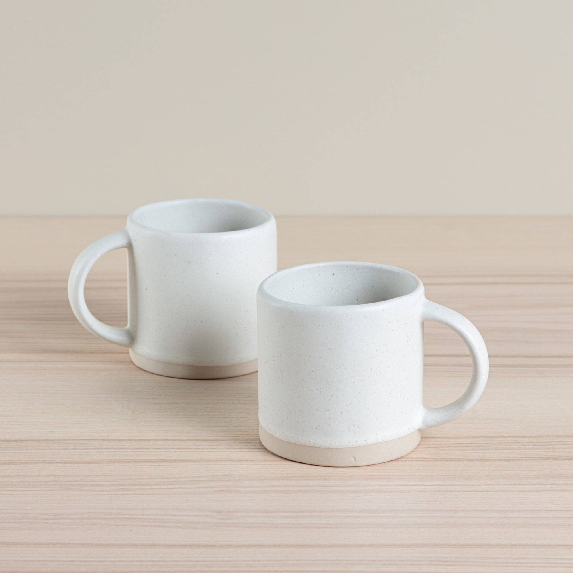 Handmade ceramic Organic Classic Mug in oatmeal, crafted using traditional hand-throwing and dipping techniques. Perfect for everyday use.