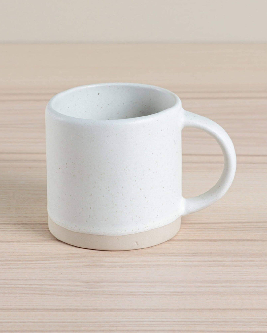 Handmade ceramic Organic Classic Mug in oatmeal, crafted using traditional hand-throwing and dipping techniques. Perfect for everyday use.