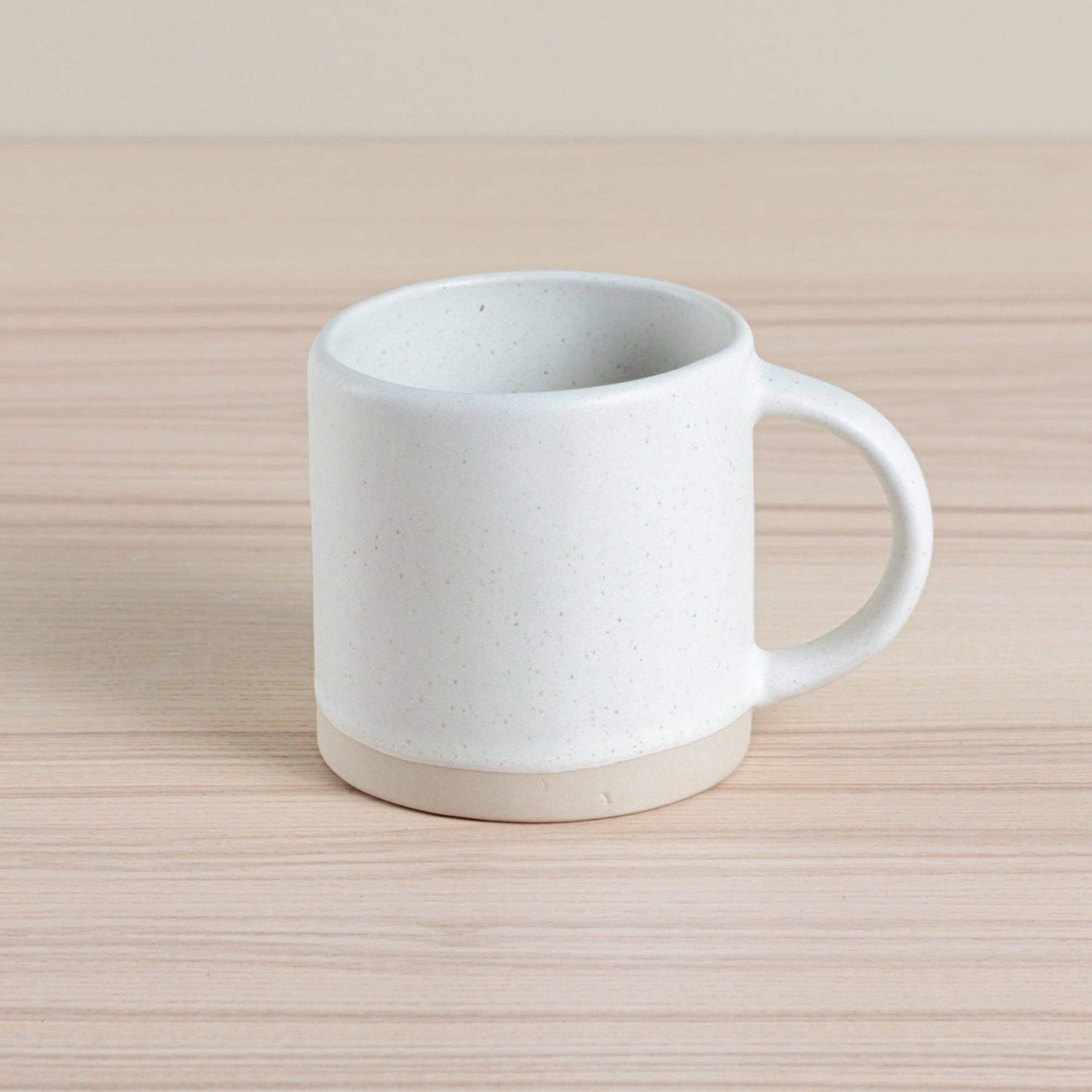 Handmade ceramic Organic Classic Mug in oatmeal, crafted using traditional hand-throwing and dipping techniques. Perfect for everyday use.