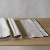 Eco-friendly table runner handcrafted from sustainable Juco fabric. A beautiful addition to your home textiles collection.